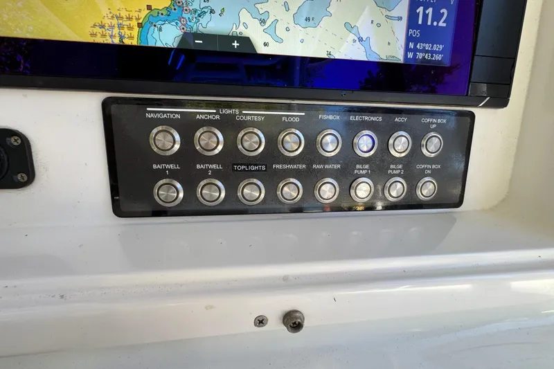  Yacht Photos Pics Control panel on a 2007 Yellowfin 34 Offshore boat with navigation and system buttons.