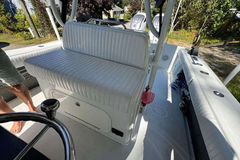  Yacht Photos Pics 2007 Yellowfin 34 Offshore boat interior with white seating and steering wheel.