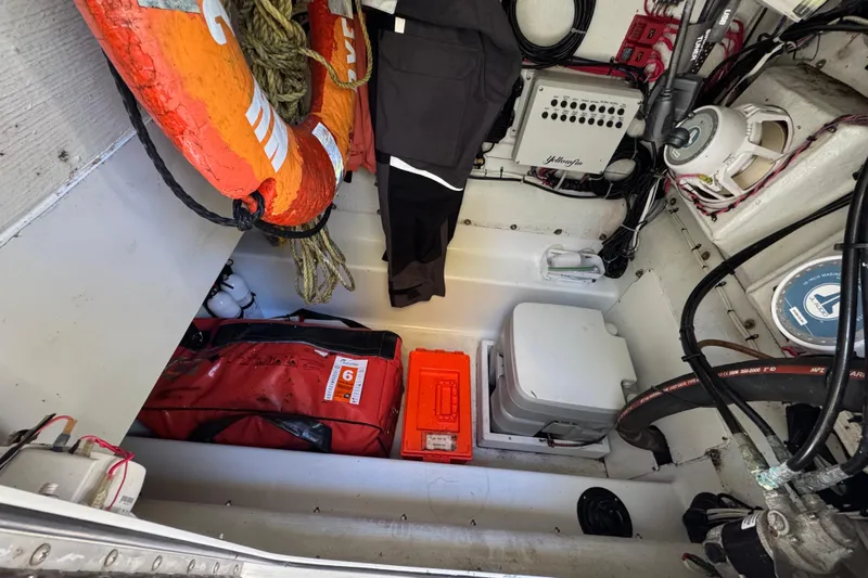  Yacht Photos Pics Storage compartment of 2007 Yellowfin 34 Offshore boat with safety equipment and gear.