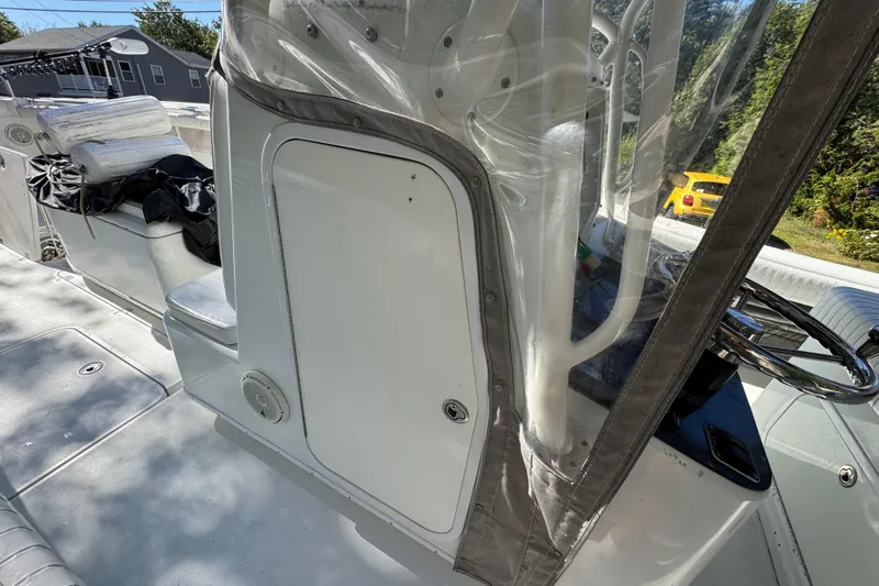  Yacht Photos Pics 2007 Yellowfin 34 Offshore boat interior with seating and steering wheel.