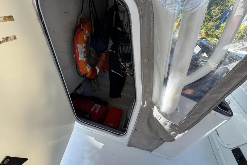  Yacht Photos Pics 2007 Yellowfin 34 Offshore cabin with life jackets and safety equipment.