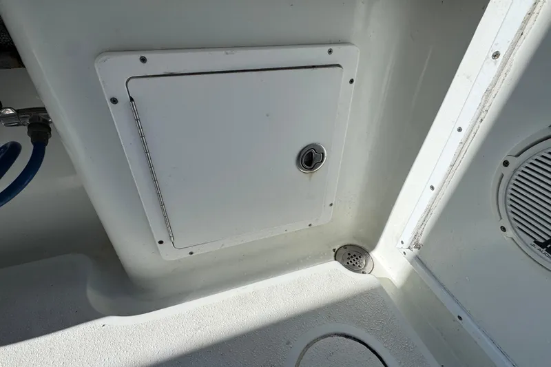  Yacht Photos Pics 2007 Yellowfin 34 Offshore boat interior with storage compartment and drain.