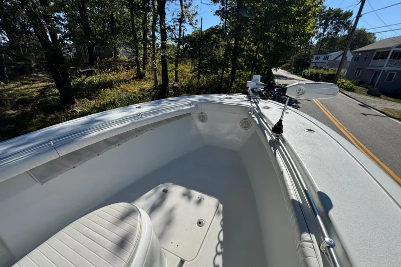  Yacht Photos Pics 2007 Yellowfin 34 Offshore boat deck with seating, parked on a tree-lined street.