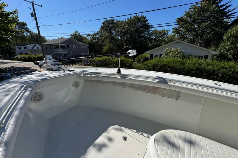  Yacht Photos Pics 2007 Yellowfin 34 Offshore boat deck with trolling motor, residential background.