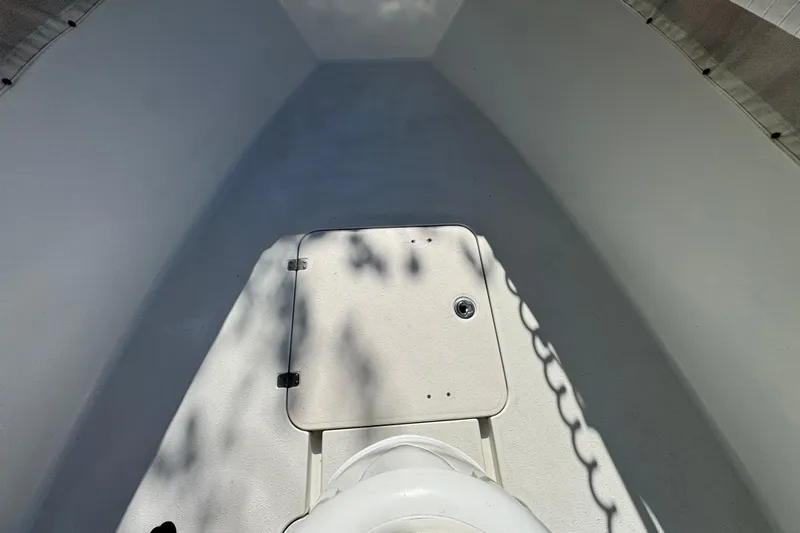  Yacht Photos Pics 2007 Yellowfin 34 Offshore boat interior with storage compartment and chain shadow.