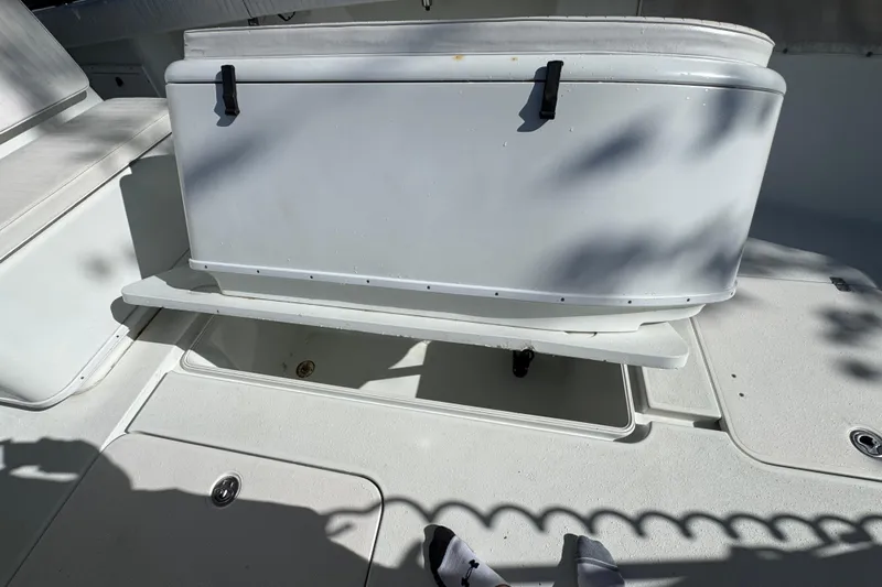  Yacht Photos Pics 2007 Yellowfin 34 Offshore boat interior with storage compartment open.