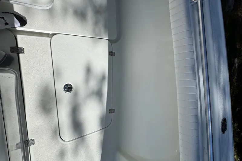  Yacht Photos Pics 2007 Yellowfin 34 Offshore boat deck with storage compartment and seating.