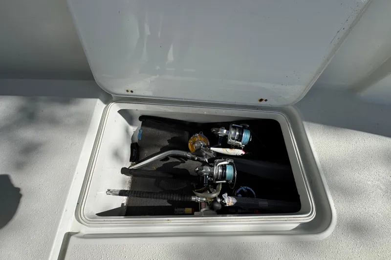  Yacht Photos Pics Fishing rods stored in a compartment on a 2007 Yellowfin 34 Offshore boat.