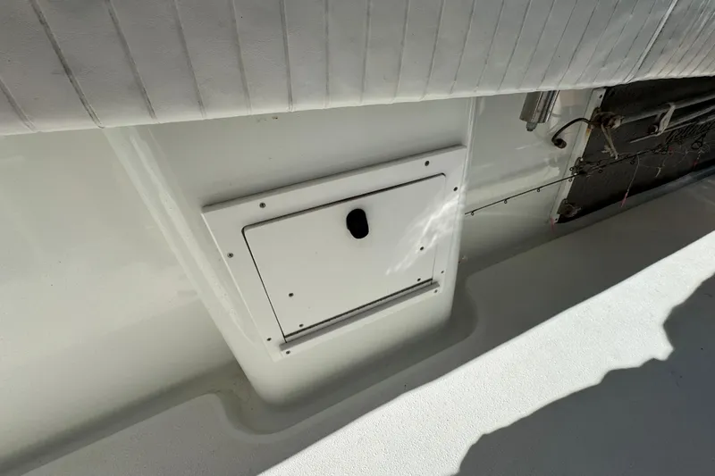  Yacht Photos Pics 2007 Yellowfin 34 Offshore boat interior with storage compartment and seating.