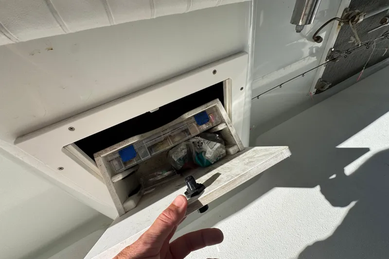  Yacht Photos Pics 2007 Yellowfin 34 Offshore boat storage compartment with fishing gear.