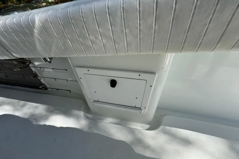  Yacht Photos Pics 2007 Yellowfin 34 Offshore boat interior with rod holders and storage compartment.