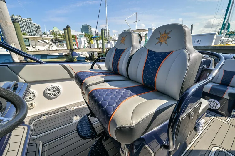 Opal Yacht Photos Pics Luxurious seating on a 2014 Midnight Express 37’ Open boat, docked at a marina.