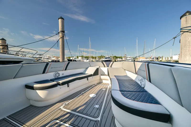 Opal Yacht Photos Pics Luxurious seating on a 2014 Midnight Express 37’ Open boat, docked at a marina.