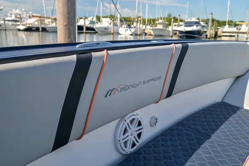 Opal Yacht Photos Pics 2014 Midnight Express 37’ Open boat interior with logo, docked at marina.