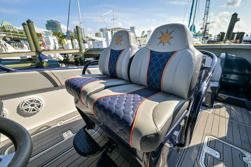 Opal Yacht Photos Pics 2014 Midnight Express 37’ Open boat with stylish, cushioned seats at a marina.
