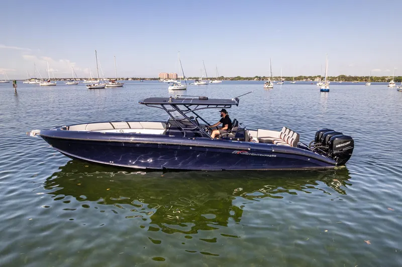  Yacht Photos Pics 2014 Midnight Express 37’ Open boat on calm water with multiple engines.