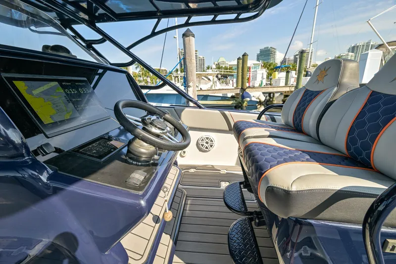 Opal Yacht Photos Pics 2014 Midnight Express 37’ Open boat interior with modern dashboard and luxurious seating.