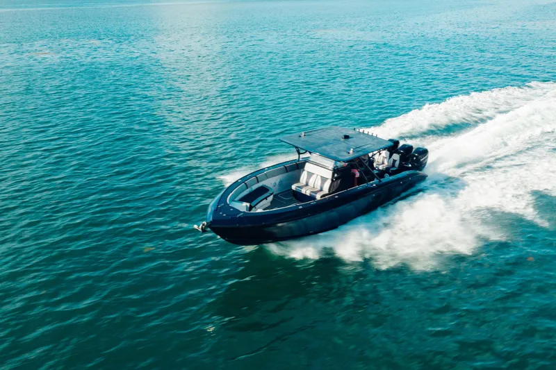 Opal Yacht Photos Pics 2014 Midnight Express 37’ Open boat cruising on blue ocean waters.