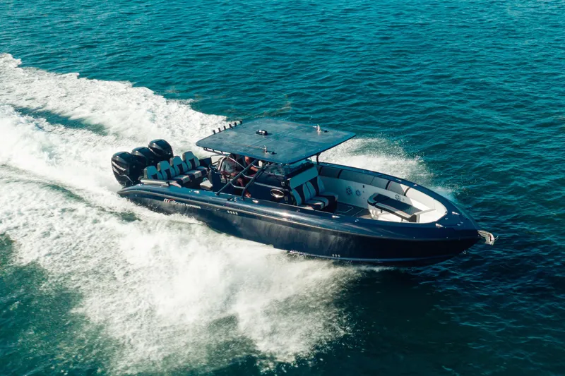 Opal Yacht Photos Pics 2014 Midnight Express 37’ Open boat cruising on blue ocean waters.