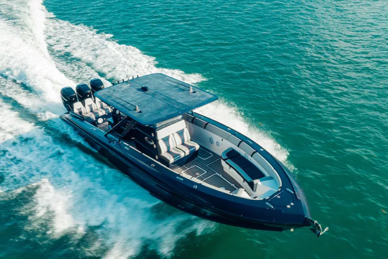 Opal Yacht Photos Pics 2014 Midnight Express 37’ Open boat cruising on clear blue water.