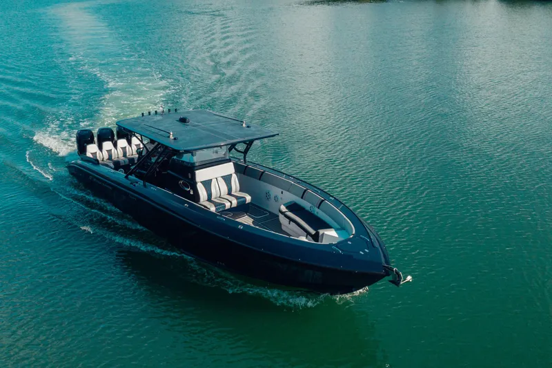 Opal Yacht Photos Pics 2014 Midnight Express 37’ Open boat cruising on calm water.