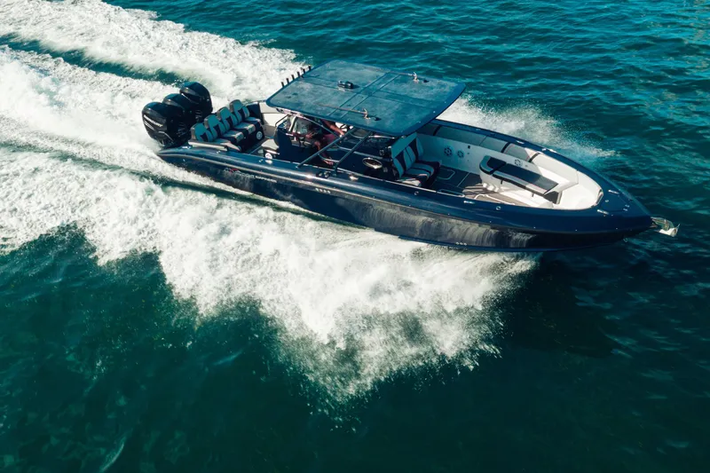 Opal Yacht Photos Pics 2014 Midnight Express 37’ Open boat cruising on blue ocean waters.