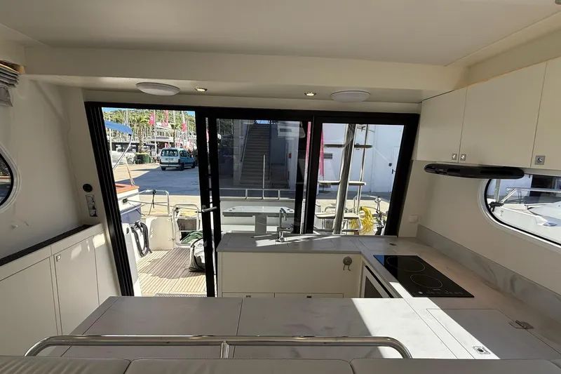 Kokkola Yacht Photos Pics Interior of 2023 Nord Star 49+ yacht with modern kitchen and outdoor view.