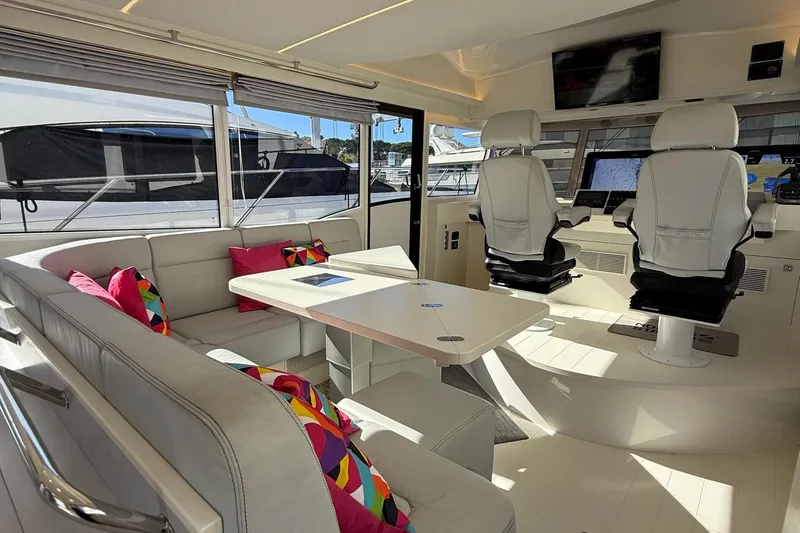 Kokkola Yacht Photos Pics Luxurious interior of 2023 Nord Star 49+ yacht with modern seating and navigation area.