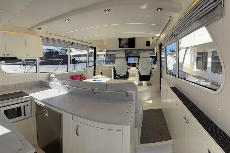 Kokkola Yacht Photos Pics Luxurious interior of 2023 Nord Star 49+ yacht with modern seating and navigation area.