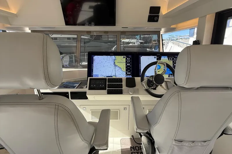 Kokkola Yacht Photos Pics Cockpit of 2023 Nord Star 49+ with navigation screens and steering wheel.