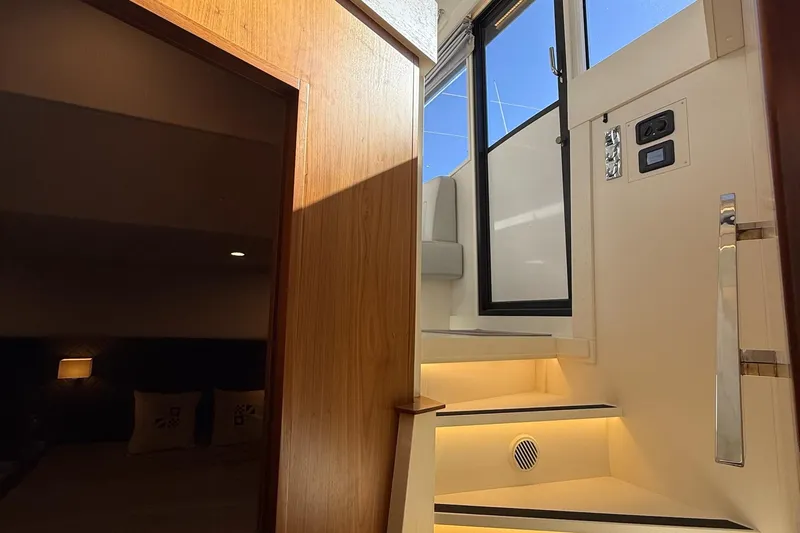 Kokkola Yacht Photos Pics Interior view of 2023 Nord Star 49+ yacht, featuring illuminated stairs and modern design.