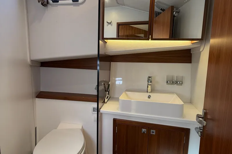 Kokkola Yacht Photos Pics Modern bathroom in 2023 Nord Star 49+ yacht with sleek sink and wooden accents.