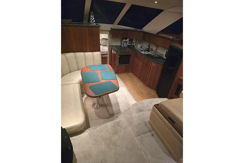  Yacht Photos Pics Interior of 2000 Silverton 392 Motor Yacht with kitchen and dining area.