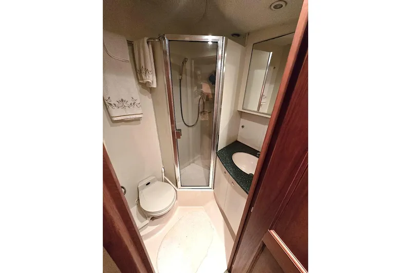  Yacht Photos Pics Bathroom interior of 2000 Silverton 392 Motor Yacht with shower and sink.