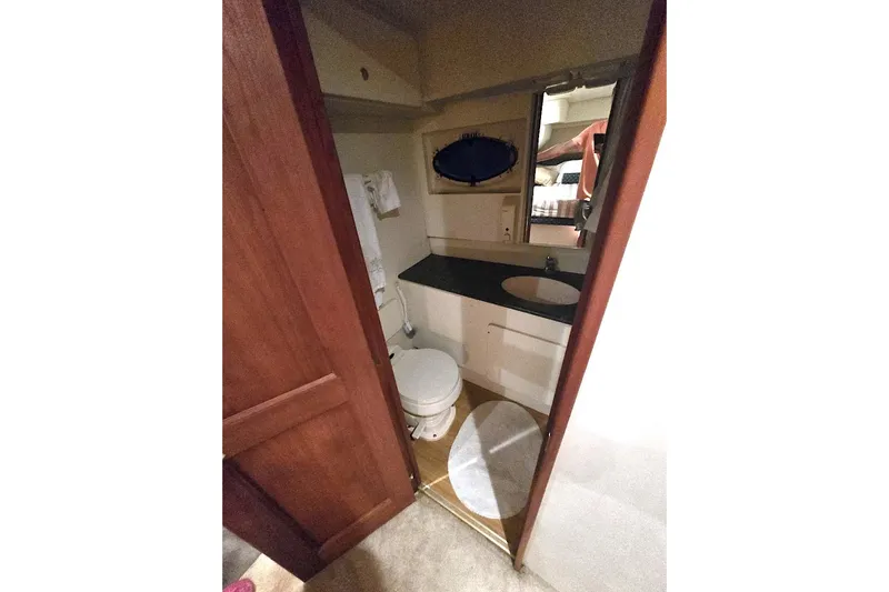  Yacht Photos Pics Interior bathroom of 2000 Silverton 392 Motor Yacht with sink and toilet.
