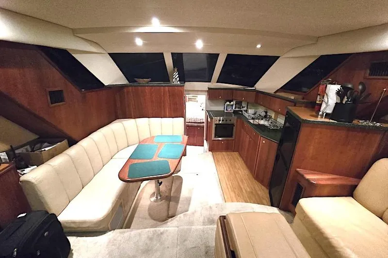  Yacht Photos Pics Interior of 2000 Silverton 392 Motor Yacht with cozy seating and modern kitchen amenities.