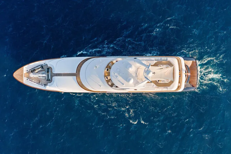 Amica Mea Yacht Photos Pics Aerial view of 2004 Hakvoort Custom yacht cruising in deep blue ocean.