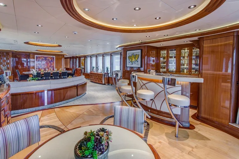 Amica Mea Yacht Photos Pics Luxurious 2004 Hakvoort Custom yacht interior with elegant bar, dining area, and modern decor.