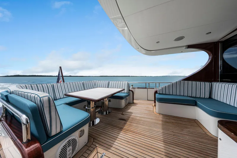 Tribu Yacht Photos Pics Luxury yacht deck with seating, Steeler 60 S Performance 2021, ocean view, blue sky.