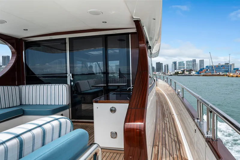 Tribu Yacht Photos Pics Luxurious 2021 Steeler 60 S Performance yacht with elegant deck and city skyline view.