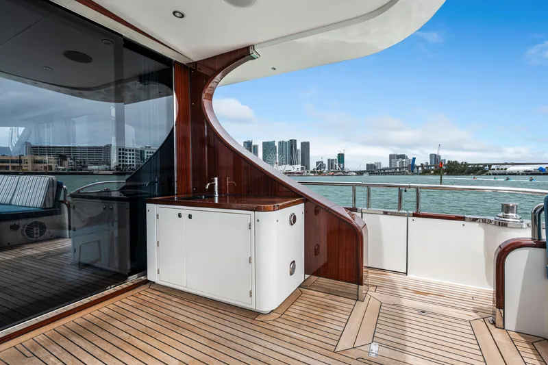 Tribu Yacht Photos Pics Luxury yacht deck of 2021 Steeler 60 S Performance with city skyline view.