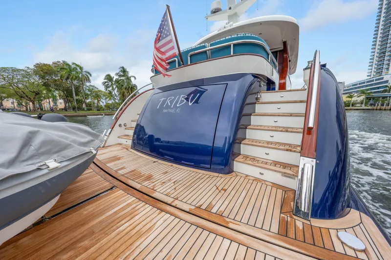 Tribu Yacht Photos Pics Luxury Steeler 60 S Performance yacht, 2021 model, with wooden deck and American flag.