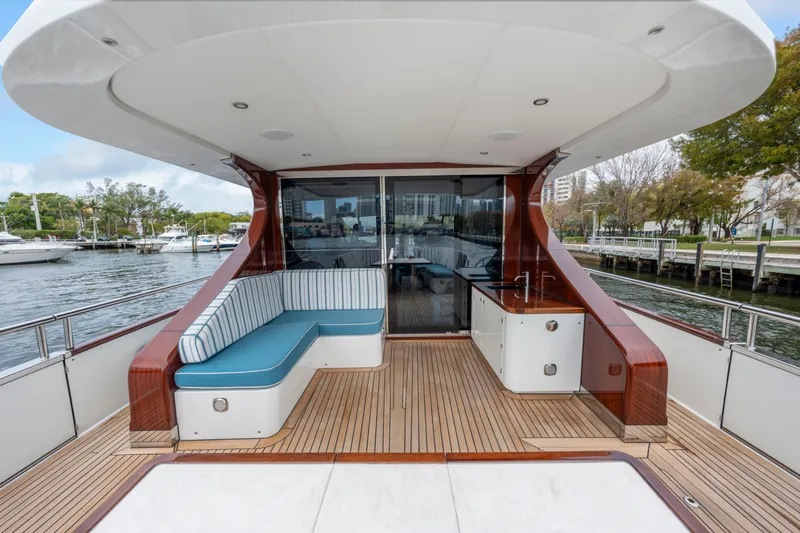 Tribu Yacht Photos Pics Luxurious 2021 Steeler 60 S Performance yacht deck with seating and waterfront view.