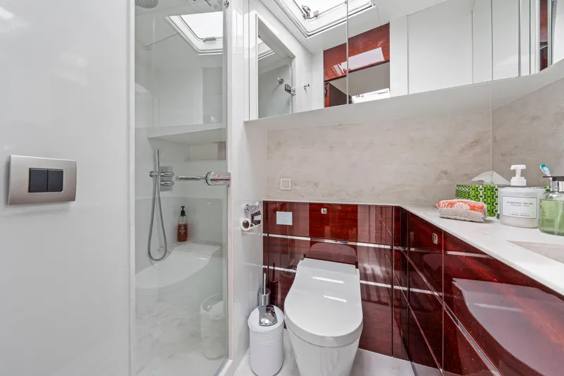 Tribu Yacht Photos Pics Luxurious bathroom in 2021 Steeler 60 S Performance yacht, featuring modern fixtures and elegant design.