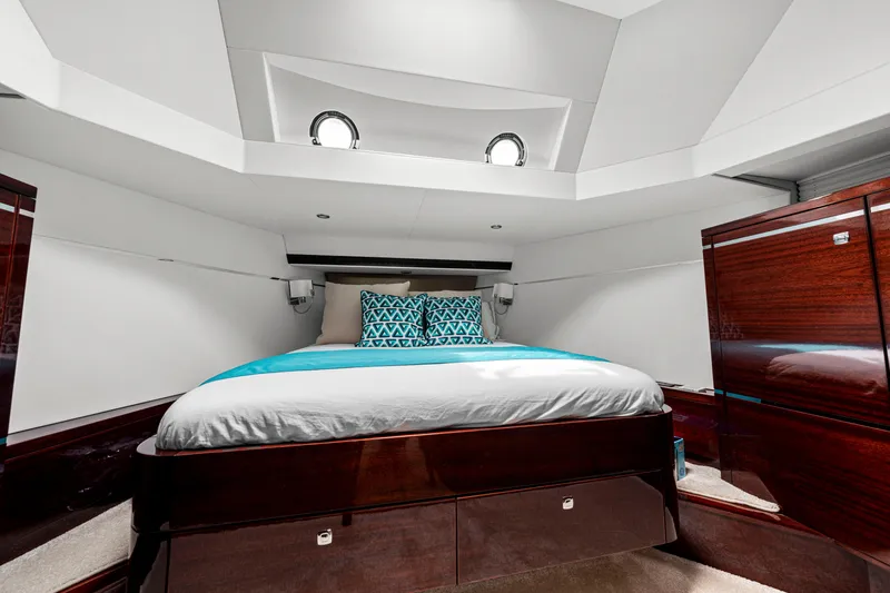 Tribu Yacht Photos Pics Luxurious bedroom interior of 2021 Steeler 60 S Performance yacht with modern design.