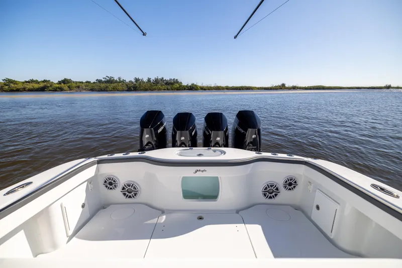  Yacht Photos Pics 2024 Yellowfin 39 Offshore boat with four powerful engines on calm water.