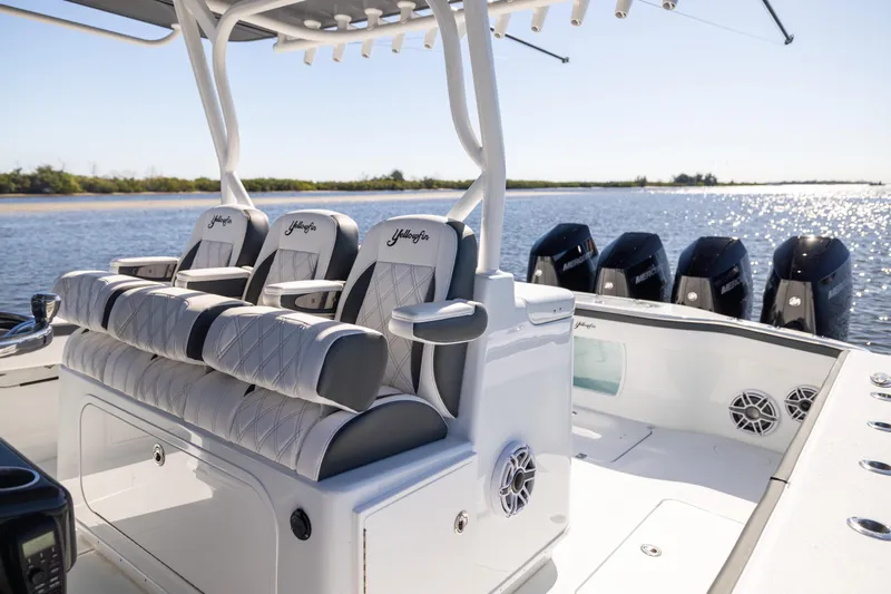 Yacht Photos Pics 2024 Yellowfin 39 Offshore boat interior with luxurious seating and multiple outboard engines.