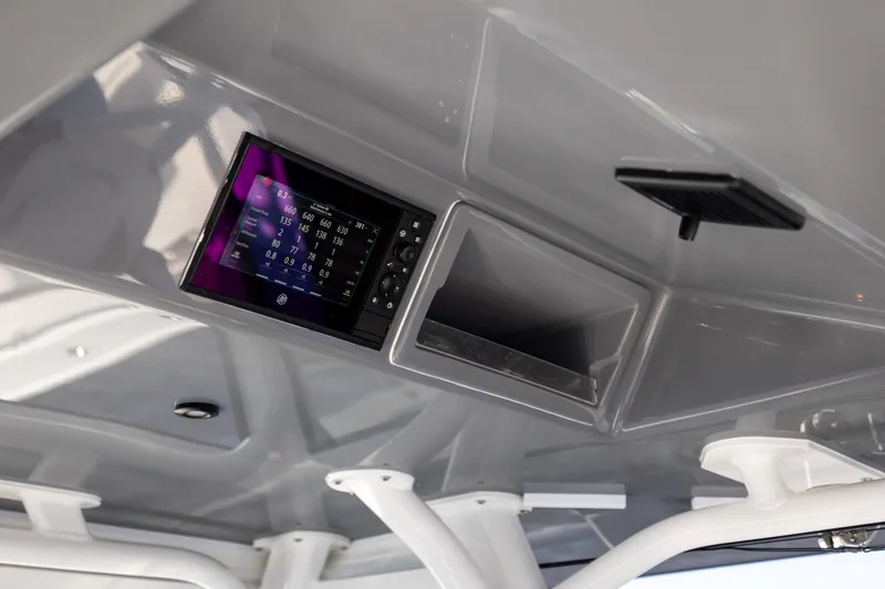  Yacht Photos Pics 2024 Yellowfin 39 Offshore boat dashboard with electronic display and storage compartment.