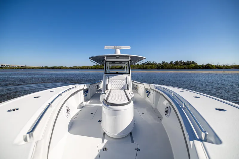  Yacht Photos Pics 2024 Yellowfin 39 Offshore boat on calm water, showcasing sleek design and spacious deck.