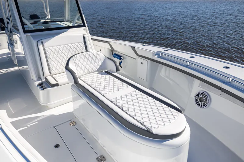  Yacht Photos Pics 2024 Yellowfin 39 Offshore boat interior with cushioned seating and ocean view.